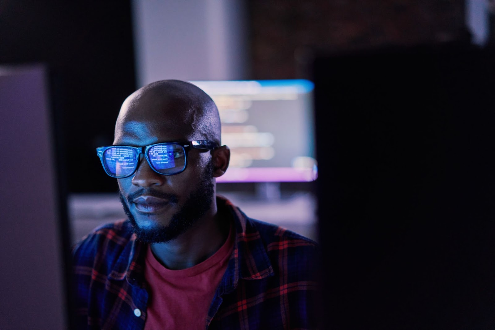 Man working on computer monitor.